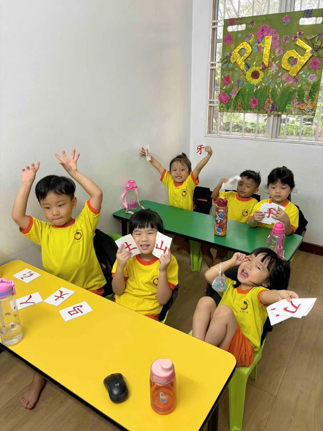 Children enjoying a classroom language activity.